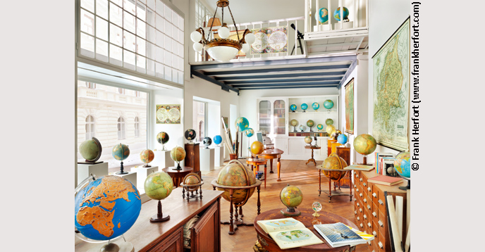 A collection of antique globes at a shop in downtown Vienna, Austria, 2011. Part of German photographer Frank Herfort’s Interiors-Public series.