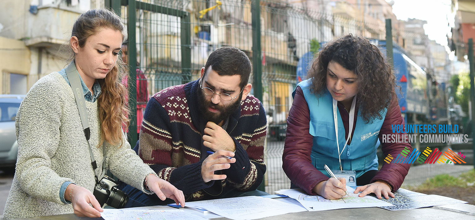 National UN Volunteer GIS Assistant, Racha Serhal (first from right), working with two UN-Habitat staff members on locating and mapping landmarks and other open spaces in Nabaa city, Beirut, Lebanon. (UNV, 2017)