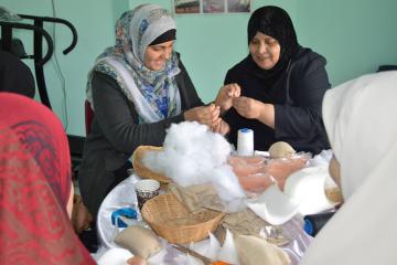 Shahd El-Swerki (left), national UN Volunteer Communications Assistant at UNDP Gaza, visited a cancer care centre and joined women volunteers in sewing breast prosthetics, which are distributed for free to female cancer patients.
