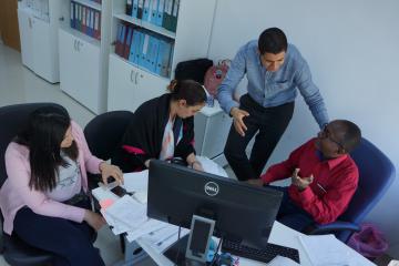 UN Volunteer Ghazi Mabrouk with colleagues at UNDP Libya office