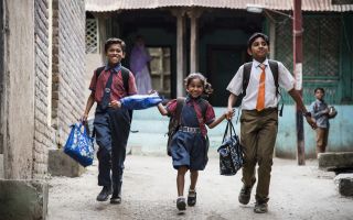 children running to school