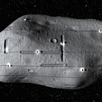 A computer-generated image of spacecrafts mining a near-Earth asteroid.