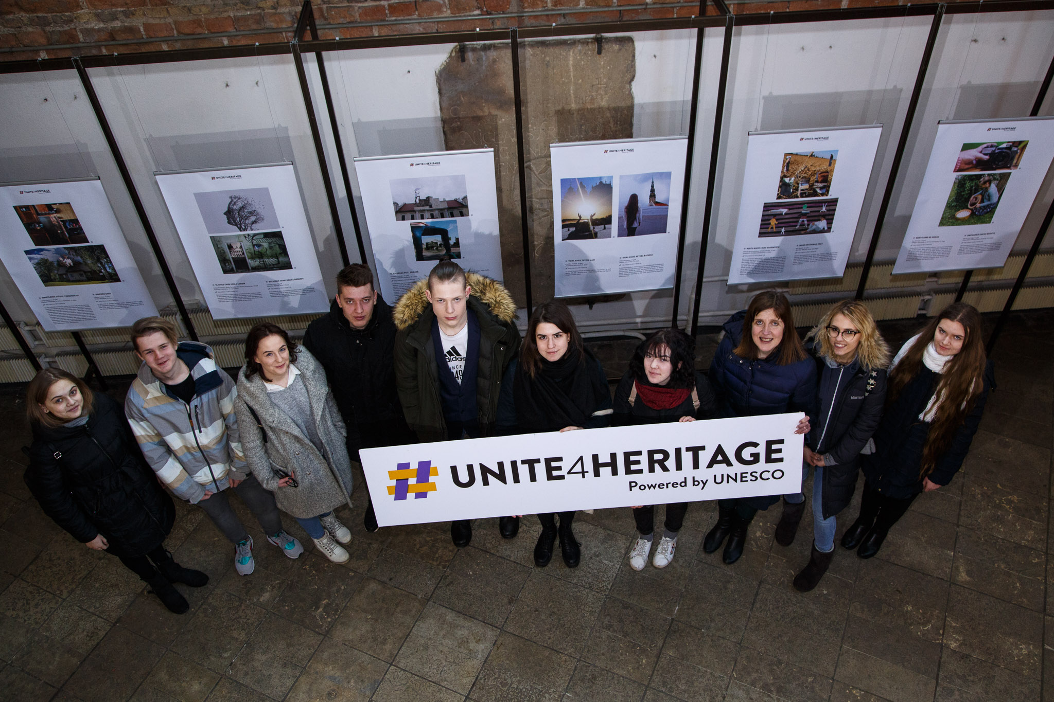 Image of participants carrying Unite4Heritage sign