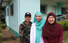 Police Officer Chrestine Espinorio, Dr. Nadhira Abdulcarim and social worker Umme Limbona work together to support survivors of violence at a hospital-based crisis centre. © UNFPA Philippines/Mario Villamor
