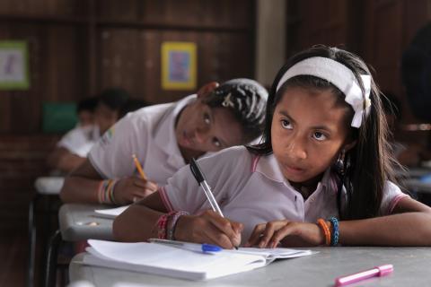 A girl takes notes in class, Colombia
