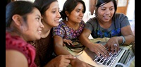young women in Guatemala use a computer. Photo: UN Trust Fund/Phil Borges