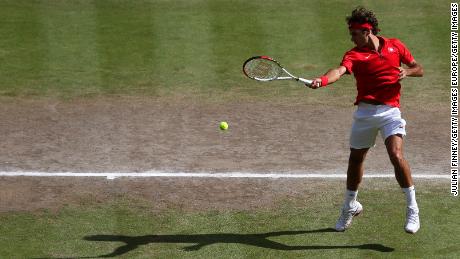 LONDON, ENGLAND - AUGUST 05:  Roger Federer of Switzerland returns a shot against Andy Murray of Great Britain during the Men&#39;s Singles Tennis Gold Medal Match on Day 9 of the London 2012 Olympic Games at the All England Lawn Tennis and Croquet Club on August 5, 2012 in London, England.  (Photo by Julian Finney/Getty Images)