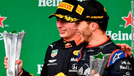 Red Bull&#39;s Dutch driver Max Verstappen (L) and Toro Rosso&#39;s French driver Pierre Gasly  celebrate with their trophies after getting the first and second place of the F1 Brazil Grand Prix, at the Interlagos racetrack in Sao Paulo, Brazil on November 17, 2019. (Photo by NELSON ALMEIDA / AFP) (Photo by NELSON ALMEIDA/AFP via Getty Images)