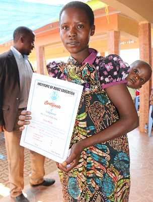 One of the graduates in Segese, Shinyaga proudly displaying her certificate