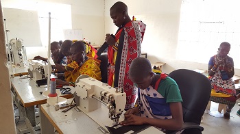Maasai young girls working in the workshop at the Community Art Space
