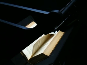 Automatic page turning book scanner