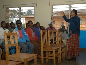 A teacher explaining about AIDS prevention in the classroom
