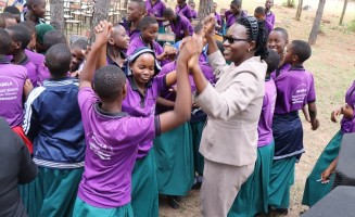 Joyous celebration between TUSEME Club members and women academicians and proffesionals during the International Day of the Girl Child