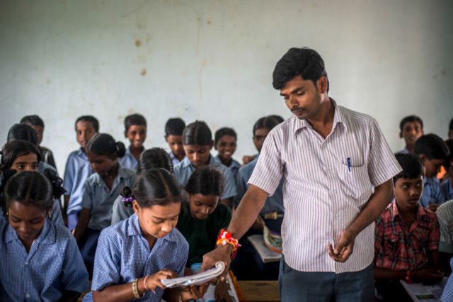 Anjaneyulu teaching at a government school in Andhra Pradesh.