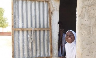  A young girl looks out the window at school in Sine-Saloum, Senegal.