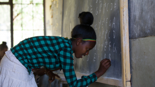Shutterstock / Ethiopian girl on the Lesson in the Amhara people school in nord Ethiopia