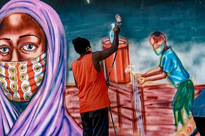 COVID-19 awareness mural in the making in Mwananyamala (Tanzania), painted in collaboration with local artists.