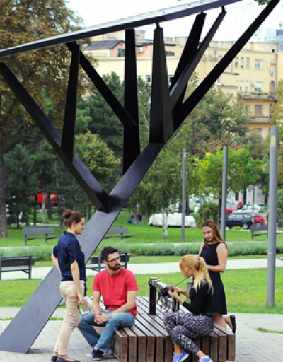 Mobile phones being charged on a smart bench in Belgrade