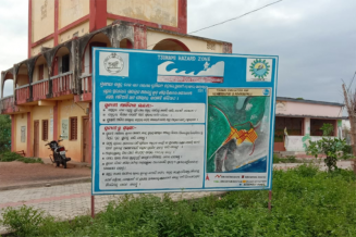 A public awareness board on Tsunami management at Venkatraipur village