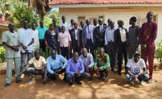 Journalists attending a workshop on the Constitution making process pose for a group photo in Rumbek 