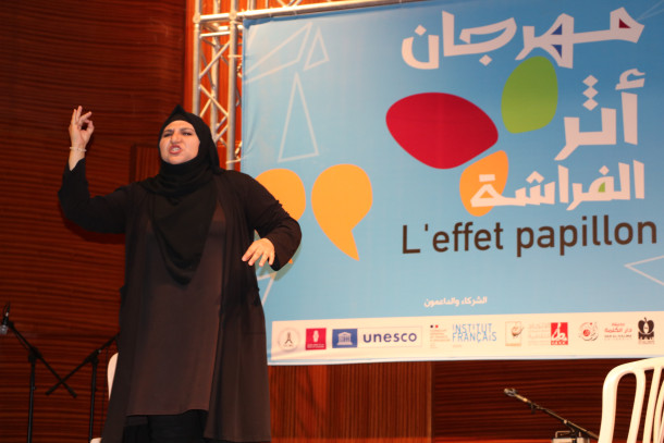 Woman performing on stage in Gaza 