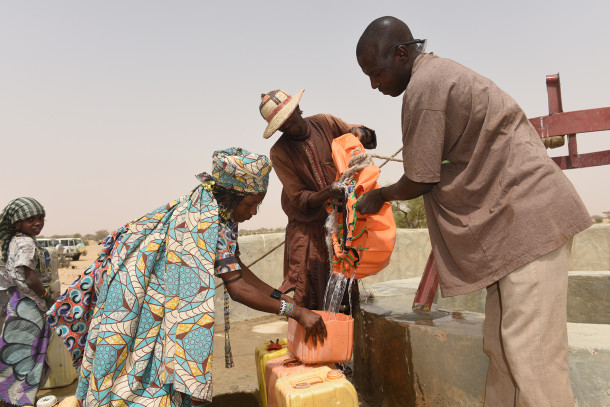 Woman drawing drinking water from a well in the Lake Chad Bassin