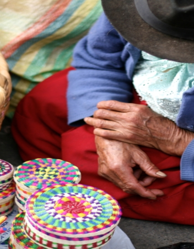 old lady selling handmade wicker boxes 'Cuenca' Ecuador